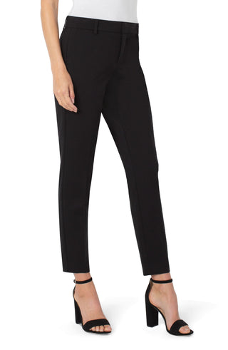 Black pants worn by a person on a white background. Liverpool Kelsey Trouser in Black