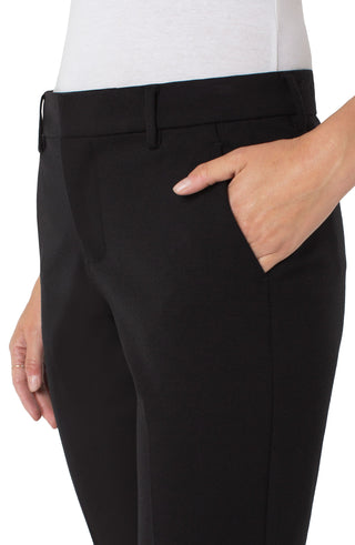 Black pants worn by a person on a white background. Liverpool Kelsey Trouser in Black