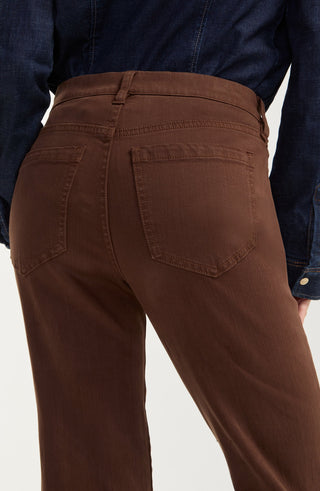 Liverpool Kennedy Straight with Comfort Waist in Carob Brown
Close-up back view of a person wearing brown high-waisted pants with a dark blue denim shirt tucked in, against a light gray background.