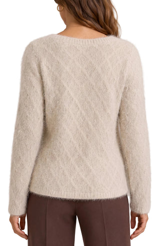Liverpool Long Sleeve Boatneck Sweater in Light Camel
A woman viewed from the back wearing a fuzzy, long-sleeve knit sweater in a warm off-white/cream color, paired with dark brown pants, against a neutral studio background.