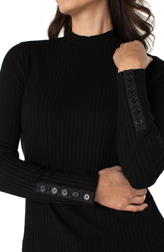 Black ribbed sweater with button details on cuffs and waistband