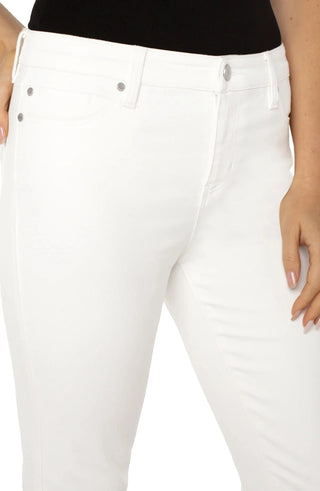 Bone white Liverpool jeans with silver buttons worn by a person on a white background.