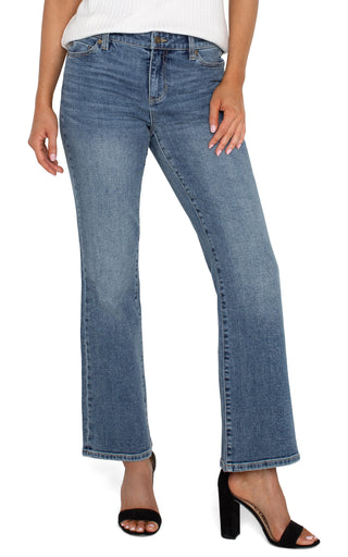A pair of slim-fit, bootcut jeans with a high waist and button closure at the front.