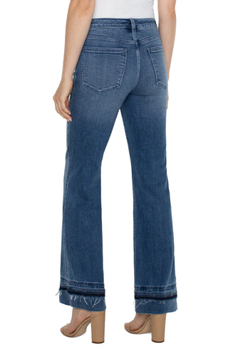 A pair of slim-fit bootcut jeans with a let-down hem.