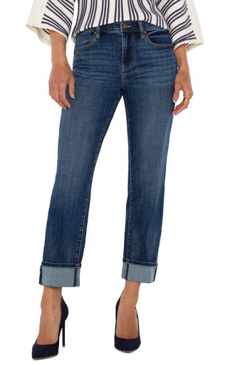 A pair of cuffed Liverpool Marley Girlfriend jeans in a medium blue wash, paired with a striped shirt and high heels.
