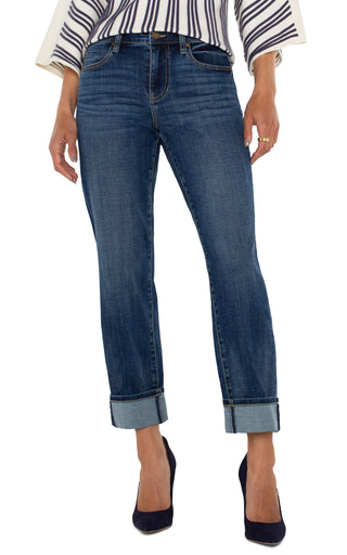 A pair of cuffed Liverpool Marley Girlfriend jeans in a medium blue wash, paired with a striped shirt and high heels.