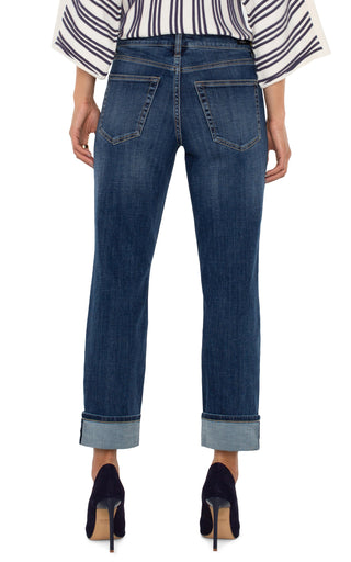 A pair of cuffed Liverpool Marley Girlfriend jeans in a medium blue wash, paired with a striped shirt and high heels.
