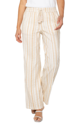 A pair of wide leg striped pants with a drawstring waist in a hazelnut cream color.