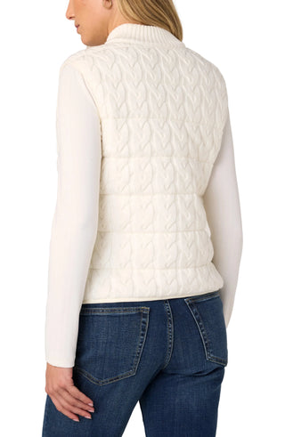 Liverpool Sleeveless Reversible Quilted Sweater Vest in Cream
A woman shown from the back wearing a cream cable-knit quilted vest over a white long-sleeve top and blue jeans, against a light gray studio background.
