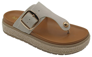 Beige sandal with a gold buckle on a light gray background. MIA Promyse Sandal