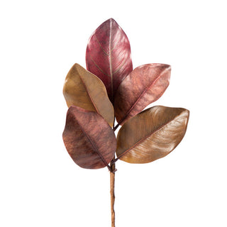 Artificial leaf branch with red and brown leaves on a white background. Magnolia Pick