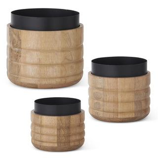 Three wooden planters with black metal tops on a white background. Mango Wood & Black Metal Nesting Pots Small medium large