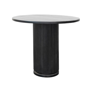 Round table with a black ribbed base on a white background. Mango Wood Dining Table with Black Ribbed Base