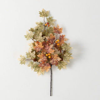 Artificial leaf branch with autumn colors on a white background