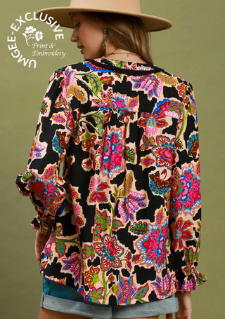 long-sleeve blouse with a bold multicolor floral and paisley print on a black background. boho blue turqoise green red pink beige