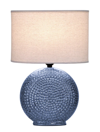 Monterey Lamp
Table lamp with textured blue base and barrel linen beige lampshade round glass