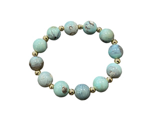 Turquoise beaded bracelet with gold accents on a white background Nana Blue Bracelet