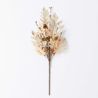 Decorative floral arrangement with leaves and cones on a white background