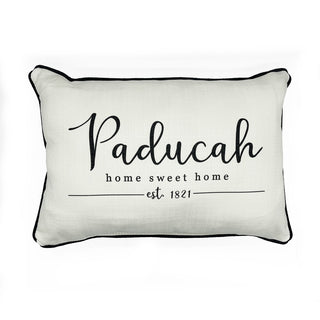 A rectangular white pillow with the text 'Paducah home sweet home est. 1821' printed in black.
