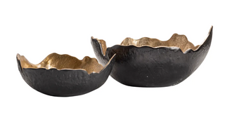 Two black and gold decorative bowls on a white background