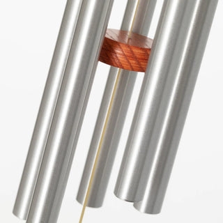 A pet sympathy windchime featuring silver aluminum tubes and a teak finish wooden windcatcher with an engraving.