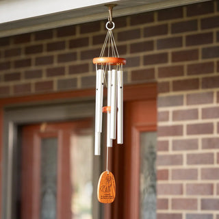 A pet sympathy windchime featuring silver aluminum tubes and a teak finish wooden windcatcher with an engraving.