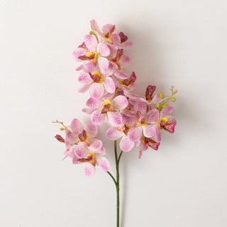 A artificial pink mini orchid spray with lifelike appearance against a white background.