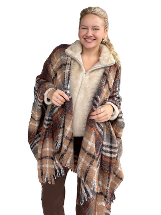 Woman in plaid poncho