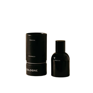 Preston Cologne, Cedarwood in a sleek black spray bottle next to the product box
