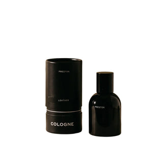 Preston Cologne, Leather in a sleek black spray bottle next to product box