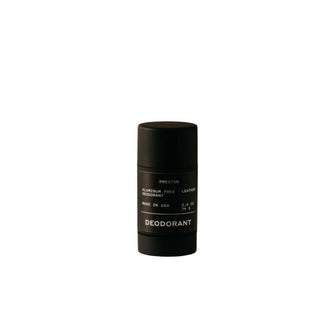 A black stick deodorant labeled 'Preston' in a simple white container.