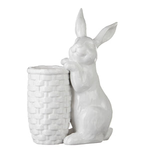 White ceramic rabbit holding a basket on a white background. Rabbit Bud Vase