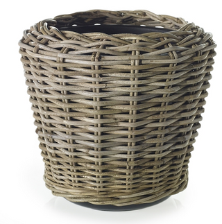 A brown rattan basket with a round shape and a flat top, hand-bent in a striking silhouette.