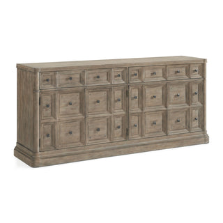A wooden credenza with six drawers and a lower shelf, featuring metal knobs and a plank-style surface. Reforma Credenza