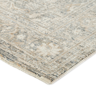 Regal RG1 Putty 7'10"x10' Rug A traditional style rug with a floral pattern in a gray, ivory, and taupe color palette, featuring a subtle space dyed design and short fringe.