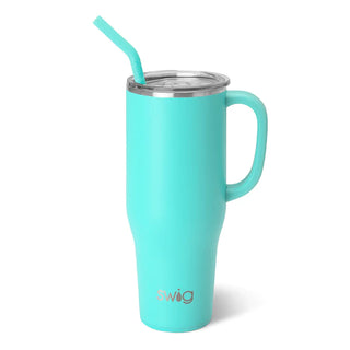 A blue stainless steel SWIG mug with a straw, featuring a comfort-grip handle and triple insulation technology.