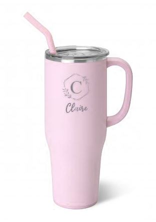 A pink stainless steel mega mug with a personalized name 'Claire' engraved on the front, featuring a straw spout and a comfort-grip handle.