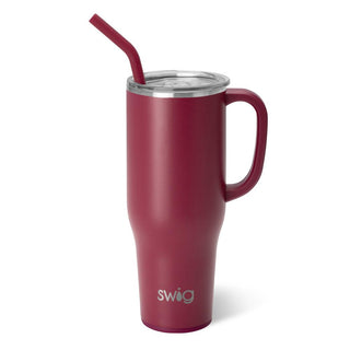 A maroon-colored stainless steel mug with a comfort-grip handle and a flexi-tip straw, featuring the brand name 'SWIG' on the front.