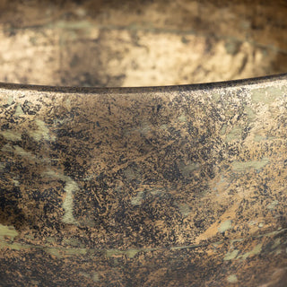 Close-up of a textured metallic surface with intricate patterns gold black