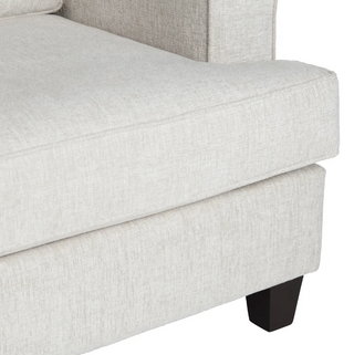 Gray upholstered couch with a wooden leg on a white background