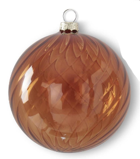 A close-up of a glossy amber-brown glass Christmas ornament with a textured pattern and a silver hanging loop, shown on a white background with part of another ornament visible at the right edge.