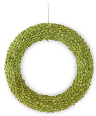 A green woven decorative wreath hanging against a plain white background.