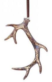 A rustic metal antler ornament with a distressed bronze and gold finish, hanging from a dark brown cord against a white background.