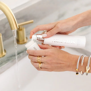 Woman putting Shinery jewelry wash on the Shinery radiance brush