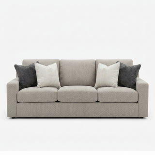 Soho Sofa in Premier Truffle
A gray fabric sofa with cream and dark gray throw pillow upholstery upholstered