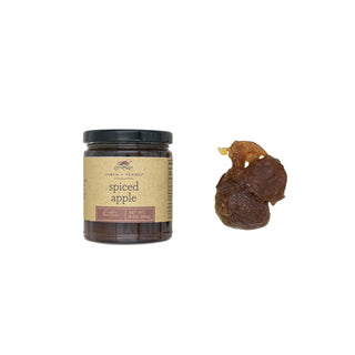 finch and fennel spiced apple butter in a glass jar 