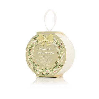 Spongelle holiday product packaging with wreath design on a white background. Spongellé Holiday Wreath Apricot Amber Spongette