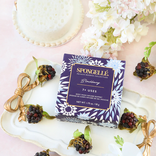Spongellé Private Reserve Blackberry Spongette sponge next to product box with tablescape background