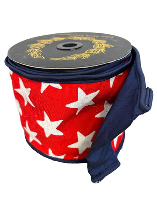 Star Print Taffeta Fused Royal Piping Ribbon 4" - SOLD BY THE FOOT
A red ribbon with white stars and navy blue piping and back