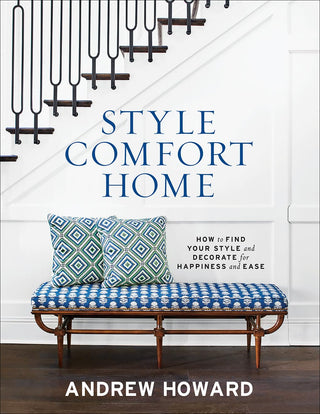 The cover of the book 'Style Comfort Home' by Andrew Howard, featuring a bench with blue cushions and a wall-mounted coat rack. Style Comfort Home.